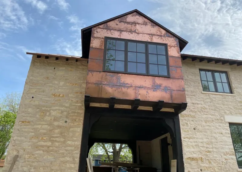Copper metal panel facade on a stone building for Metal Roof Coating in Montgomery